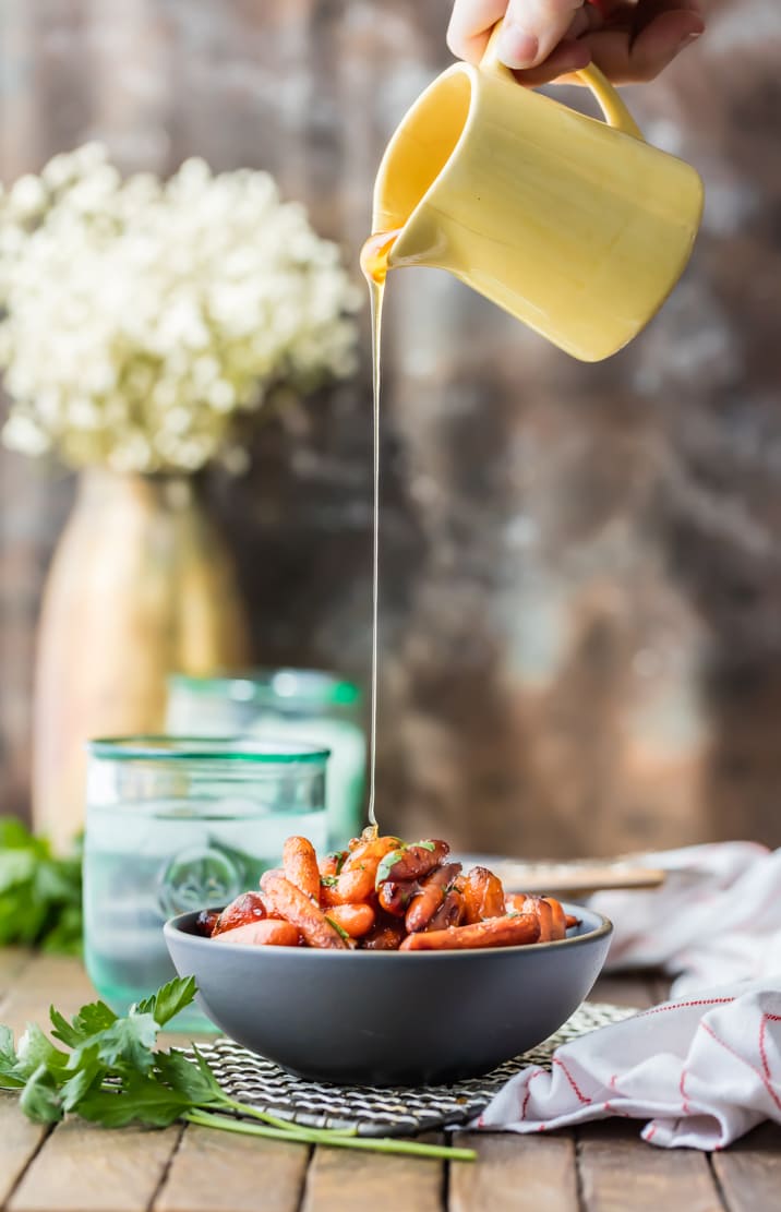 pouring honey on carrots