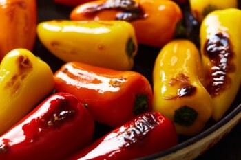 tricolor blistered sweet peppers in a frying pan.