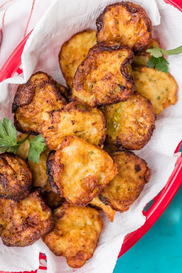 Ranch Fried Pickles are the perfect easy snack or sandwich topper! Crispy and crunchy, with a tangy ranch flavor. So addicting! close up of basket of ranch fried pickles