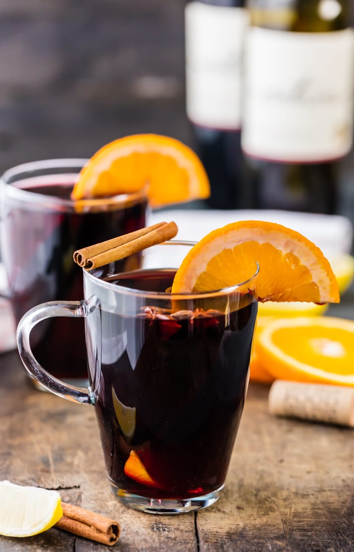 Holiday Spiced Wine, garnished with cinnamon and oranges