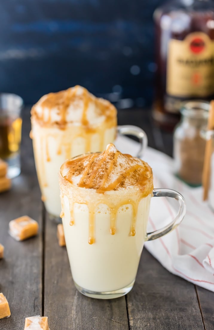 Easy eggnog recipe topped with cinnamon, fluffed egg whites, and caramel syrup