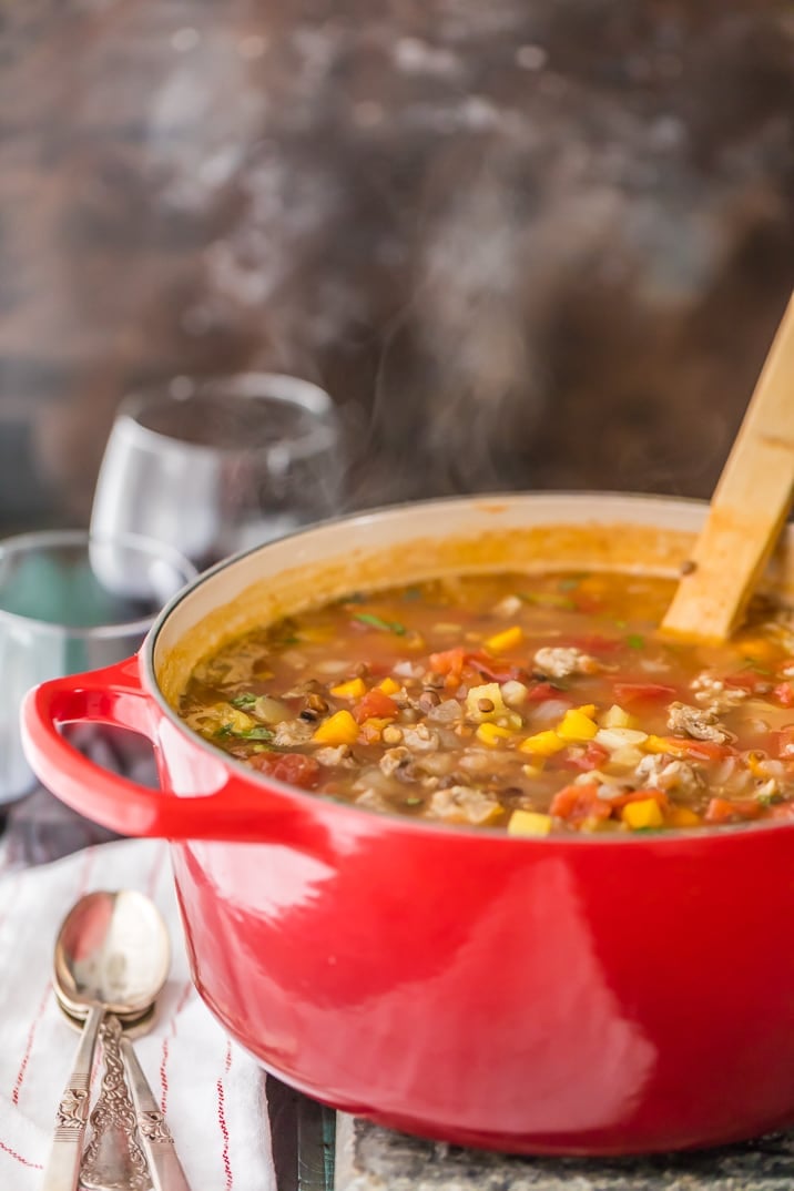 sausage lentil soup in a red pot