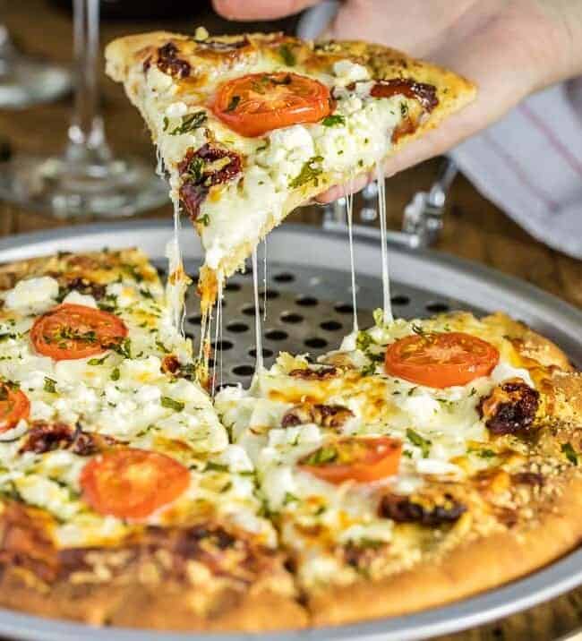 Easy Gourmet White Pizza Copycat. This pizza is SO GOOD! Made to be like the popular Mellow Mushroom Pizza favorite. Lots of cheese, two types of tomatoes, and an olive oil garlic base. BEST RECIPE EVER!