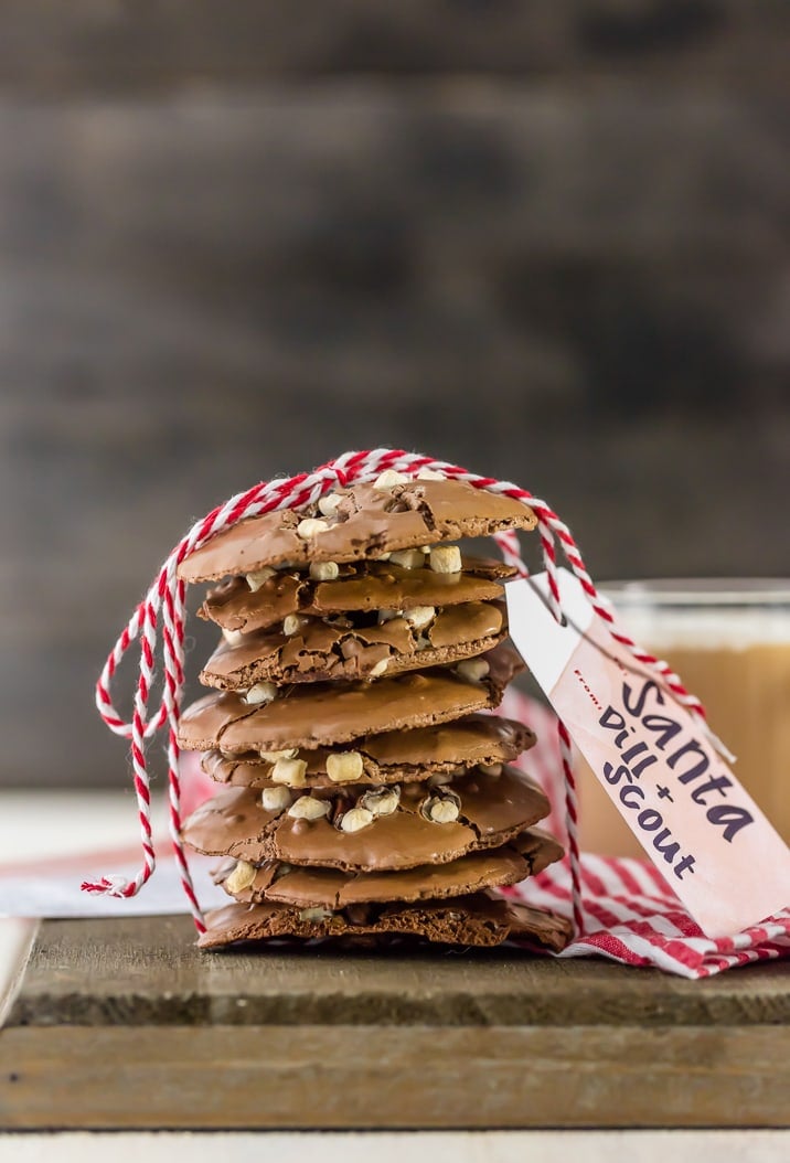 Flourless Hot Chocolate Cookies are a rich, fudgy treat fancy enough to serve at a holiday party, but easy enough to whip up anytime chocolate cravings hit. stack of flourless hot chocolate cookies tied with red and white ribbon