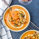 Vegan Pumpkin Soup with Candied Cashews in bowls