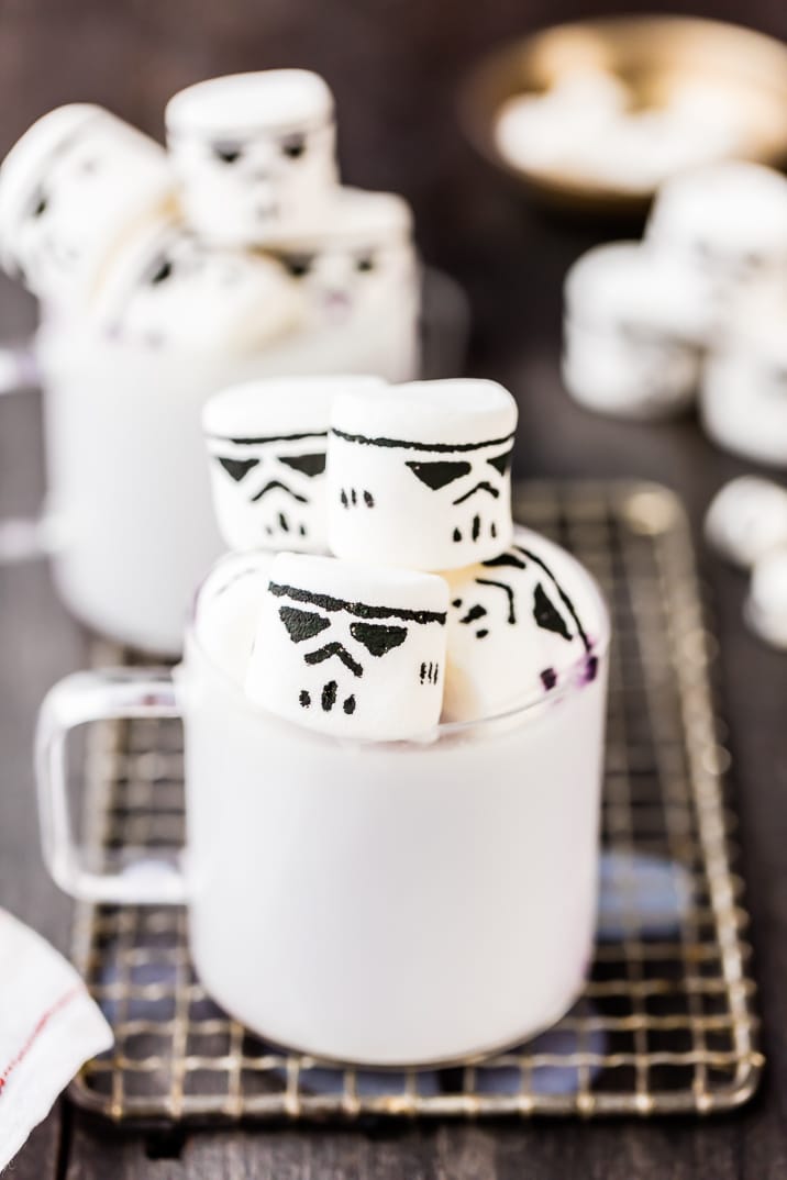 mugs of white hot chocolate and stormtrooper marshmallows on a wire rack
