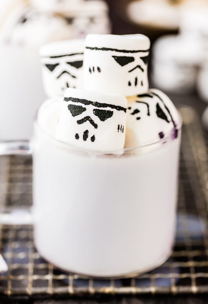 white hot chocolate in a glass mug with marshmallows