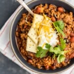 This Best Chili Recipe has been in our family for years. I've had a lot of chili in my life, from white chicken chili to vegetarian chili, and this is hand's down the BEST CHILI I have ever tasted. Two types of meat, lots of beans, and loaded with cheese, sour cream, crackers, and more! You will want to eat this Best Easy Chili Recipe year round, not just the cold months. 