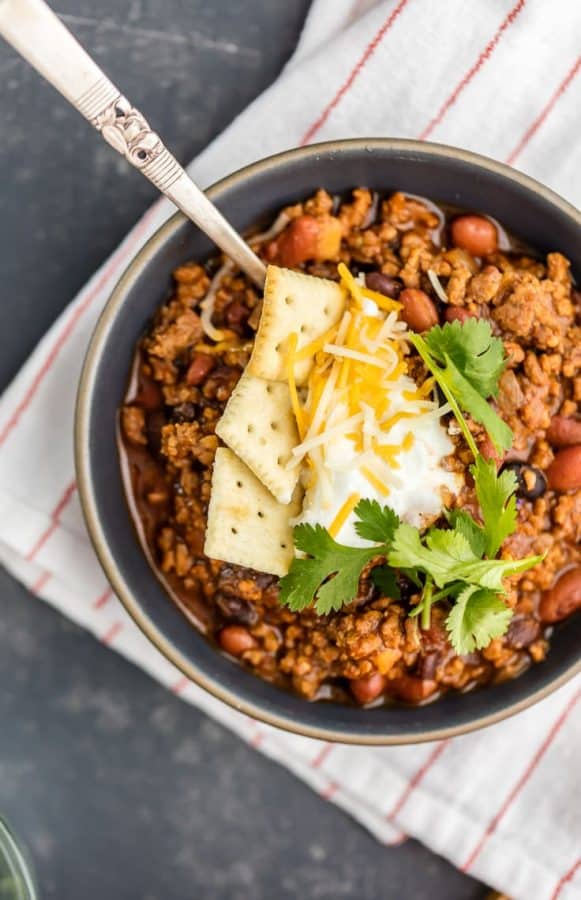 This Best Chili Recipe has been in our family for years. I've had a lot of chili in my life, from white chicken chili to vegetarian chili, and this is hand's down the BEST CHILI I have ever tasted. Two types of meat, lots of beans, and loaded with cheese, sour cream, crackers, and more! You will want to eat this Best Easy Chili Recipe year round, not just the cold months. 