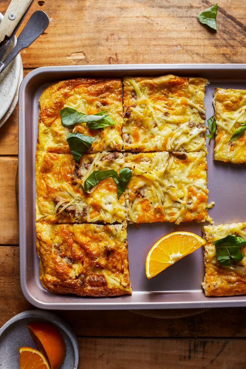 sliced sheet pan breakfast pizza on table