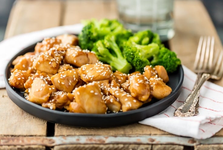 easy teriyaki chicken recipe on a plate with broccoli, set with two forks