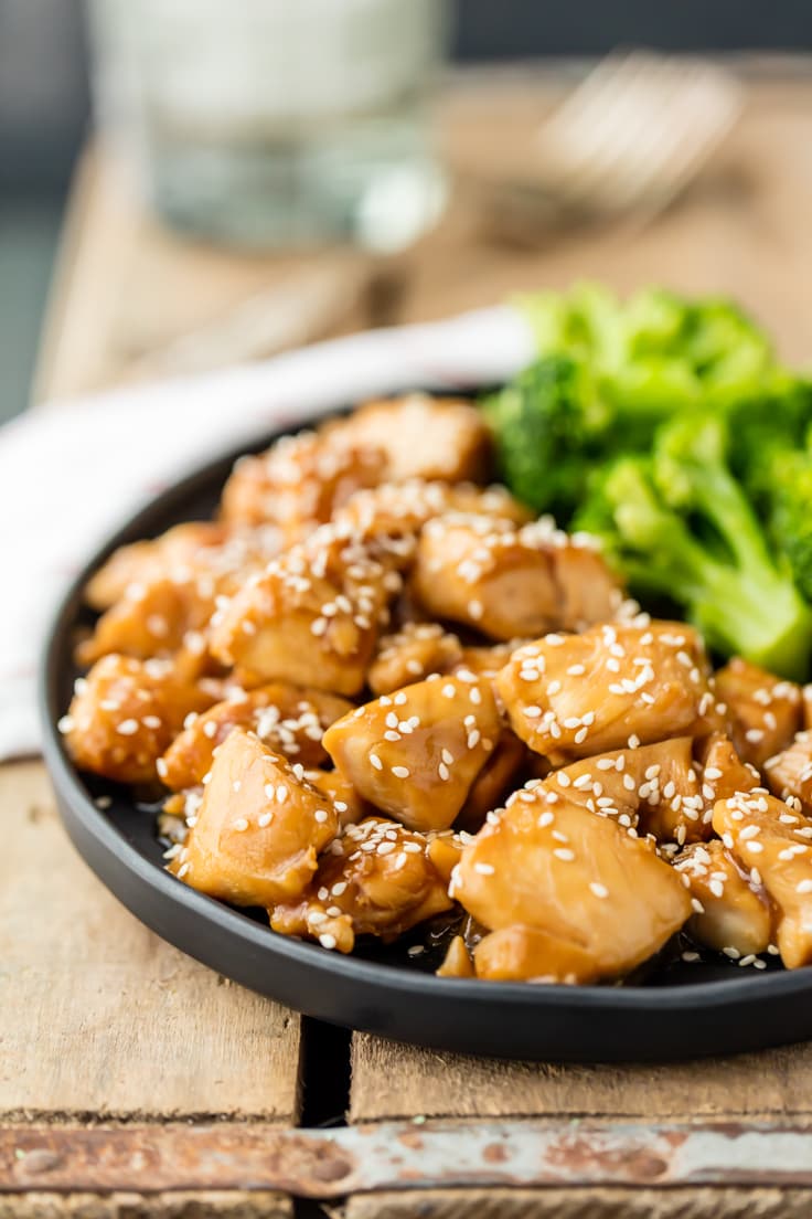 a plate of chicken teriyaki with broccoli