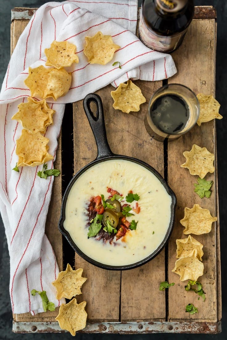 This Queso recipe is the most delicious white cheese dip you will ever taste. If you're looking for an easy queso dip recipe, you've come to the right place. No velveeta, just real quality cheese and ingredients melted together and ready to dip. Just like what you get at your favorite Mexican restaurant! white queso dip served in cast iron skillet