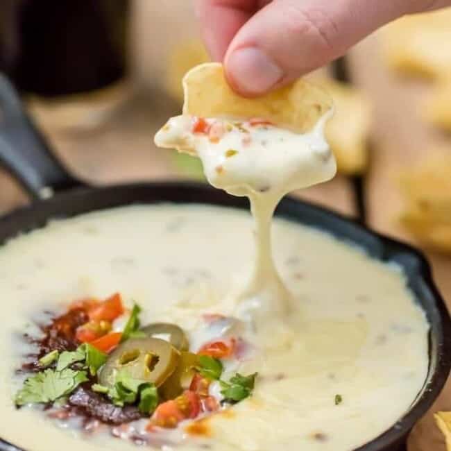 Easy Restaurant Style WHITE QUESO is our FAVORITE DIP RECIPE EVER. The EASY QUESO RECIPE tastes just like queso dip at Mexican restaurants! I have been waiting my entire life for this cheese dip recipe! 