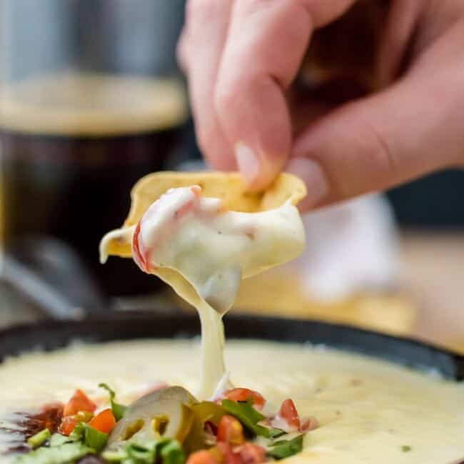 Easy Restaurant Style WHITE QUESO is our FAVORITE DIP RECIPE EVER. The EASY QUESO RECIPE tastes just like queso dip at Mexican restaurants! I have been waiting my entire life for this cheese dip recipe! 