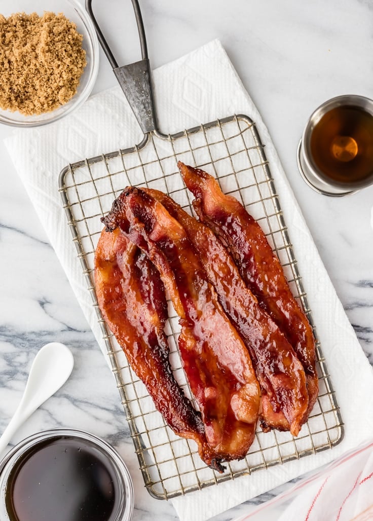 oven baked candied whiskey bacon on a cooling rack