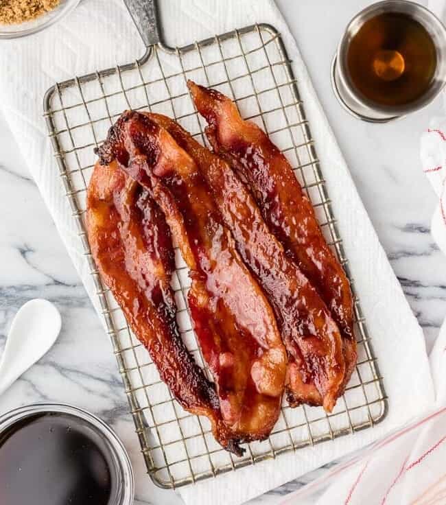 Oven Baked Candied Whiskey Bacon is the BEST bacon recipe for breakfast, sandwiches, salads, and everything in between! Baked in the oven! BEST BACON EVER!