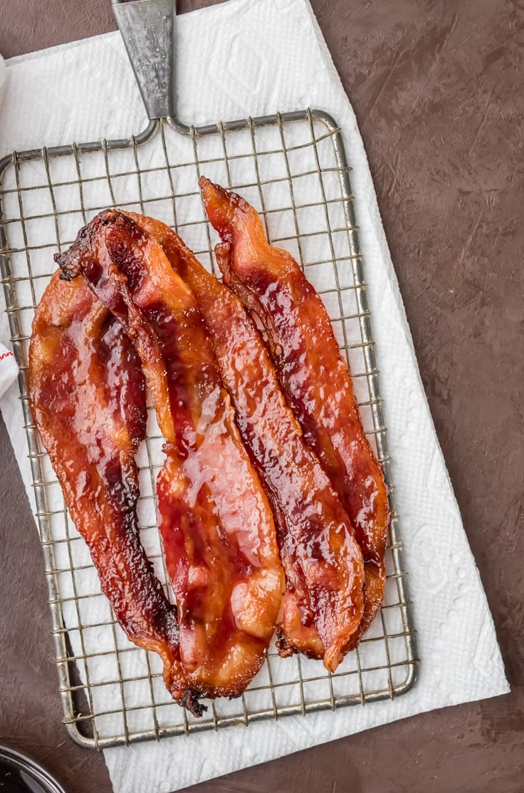 oven baked candied whiskey bacon on cooling rack