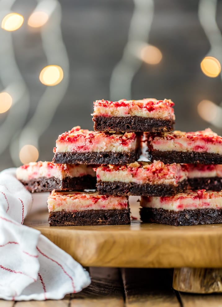 Peppermint Cheesecake Brownies stacked on top of each other