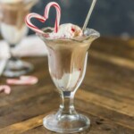chocolate ice cream with candy canes in a glass.