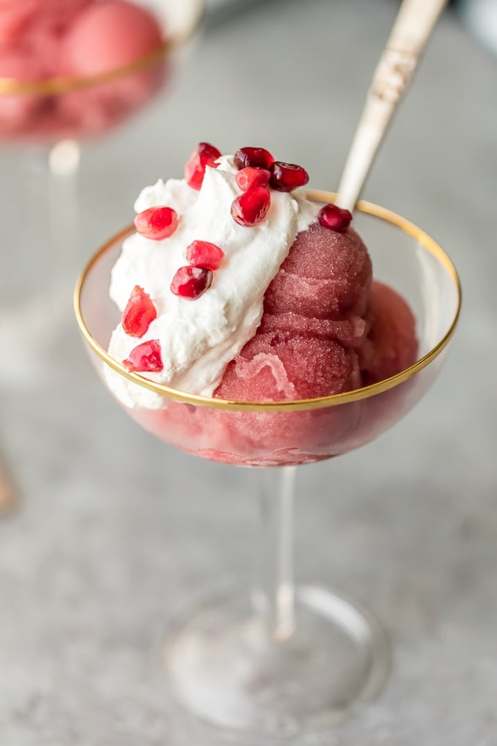 A gold rimmed glass with champagne sorbet