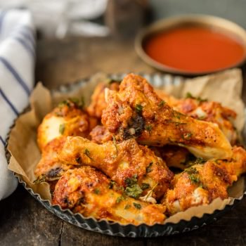 Simple Spiced Baked Chicken Wings are rubbed with simply paprika, garlic, and salt and pepper. THESE ARE SO DELICIOUS! This easy recipe is perfect with any dipping sauce. Crispy Oven Baked Wings do exist!