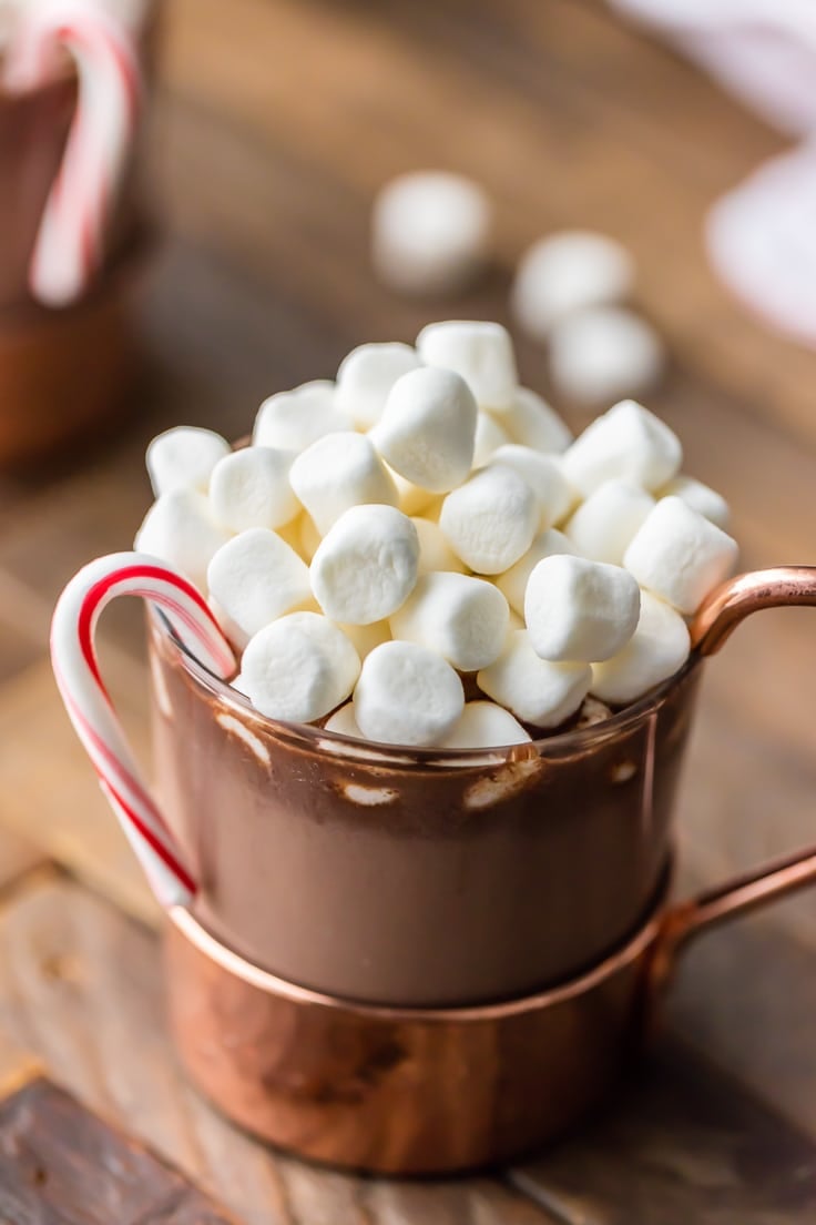 Slow Cooker Peppermint Hot Chocolate in a mug and topped with marshmallows and a candy cane