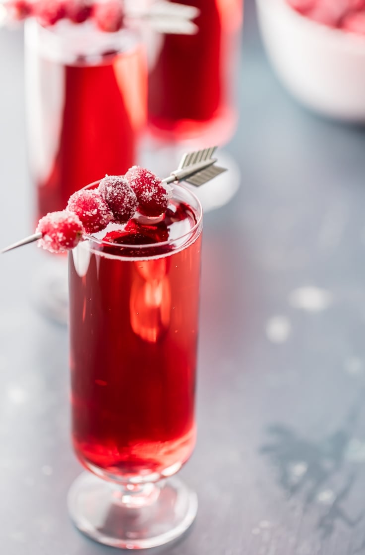 sugared cranberries on top of cranberry ginger mimosas