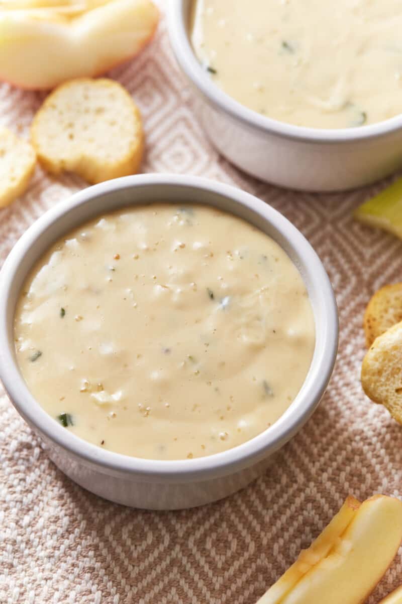 white wine fondue in white bowls.