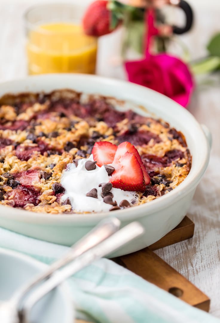 chocolate and strawberry baked oatmeal in a large round white dish