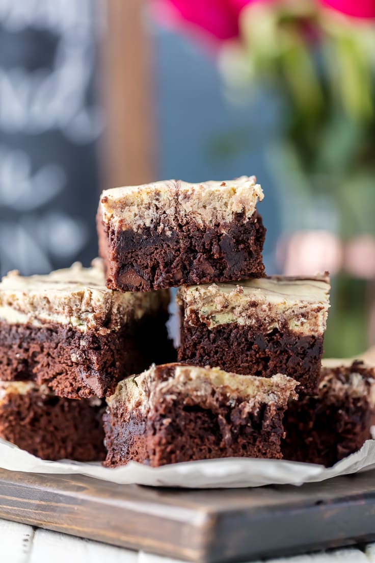 cream cheese brownies stacked up on a plate