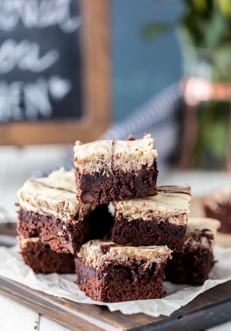 close up on a stack of caramel cream cheese brownies