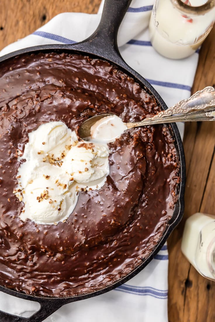 chocolate cake made in a skillet, topped with ice cream