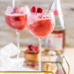 pink champagne floats in wine glasses on a tray