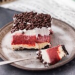 Red Velvet Cheesecake Dessert Lasagna is THE dessert for red velvet lovers! This delicious red velvet dessert is made with layers of cheesecake, chocolate pudding, chocolate chips, and whipped cream. It's creamy and tasty, the perfect Valentine's dessert!