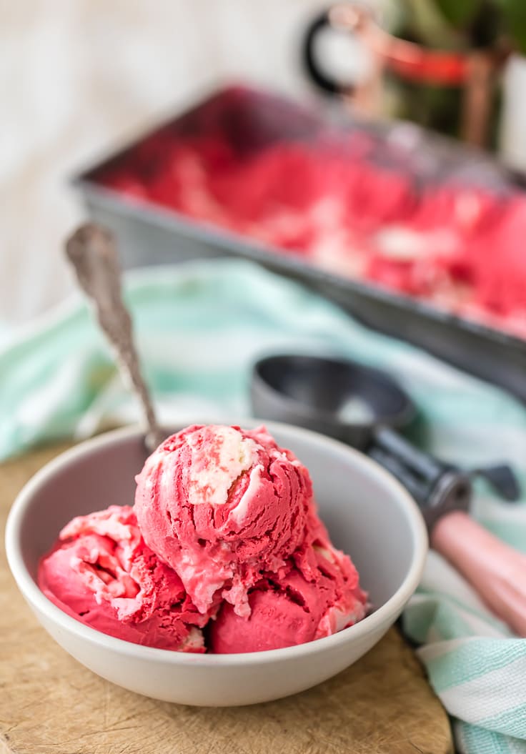 three scoops of red velvet ice cream in a white bowl