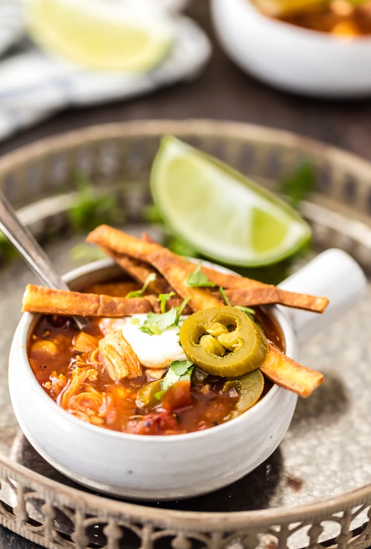healthy crockpot chicken tortilla soup with jalapenos, tortilla strips, and more