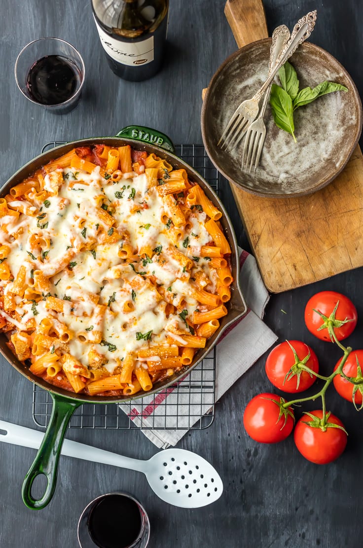 Chicken Parmesan Pasta Recipe uses only 6 ingredients and made in ONE PAN! This is our go-to easy dinner recipe anytime we are craving comfort food. A delicious chicken and pasta recipe everyone in the family will love! Skillet Chicken Parmesan for the win!