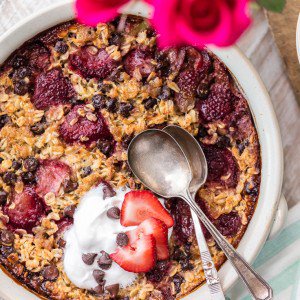 baked oatmeal in a bowl with two spoons