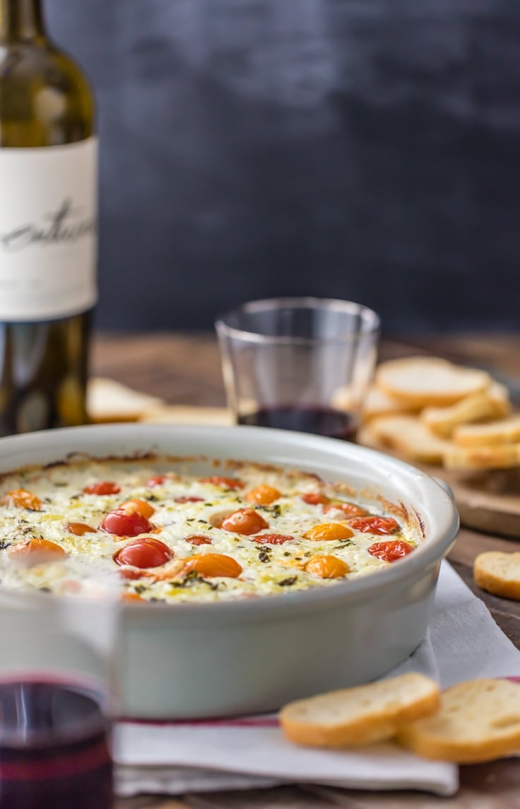 tomato goat cheese dip in a large white serving dish