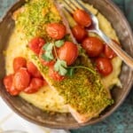 Herb Crusted Salmon with Goat Cheese Polenta on a plate