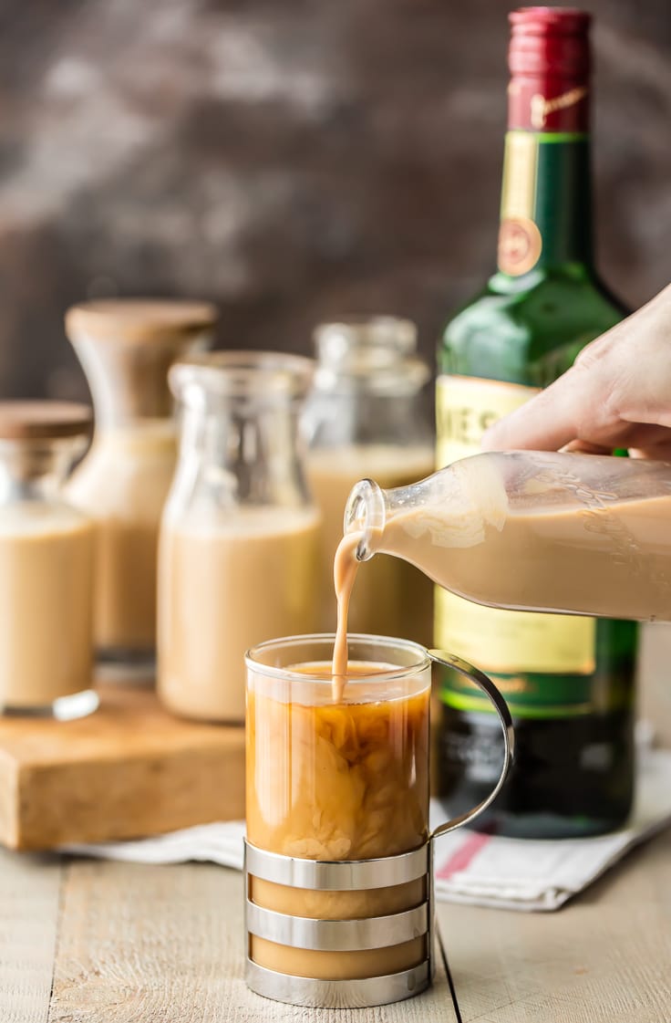 pouring homemade bailey's into coffee