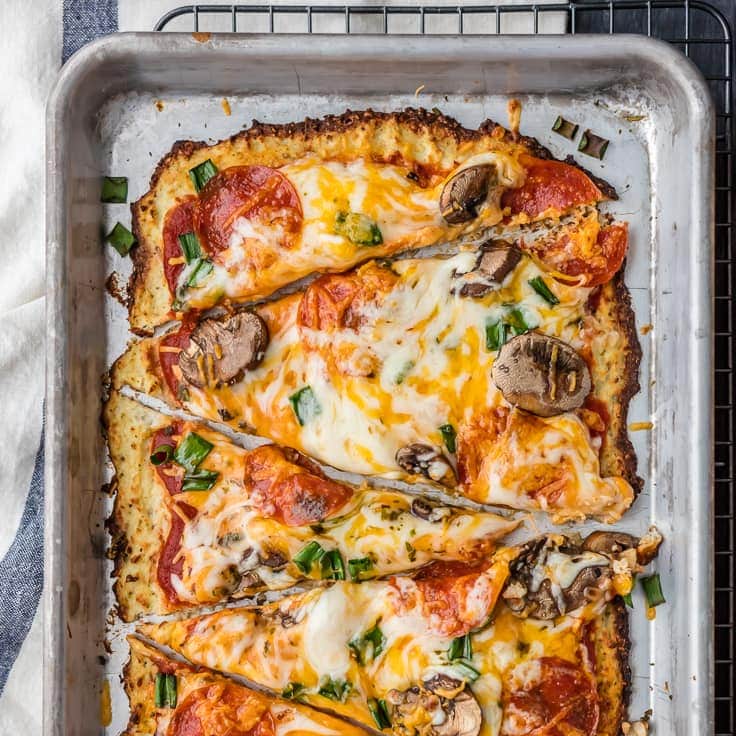 Pepperoni and Mushroom Cauliflower Pizza is LOW CARB and delicious! EASY and healthy recipe still full of flavor! We love cauliflower pizza crust!