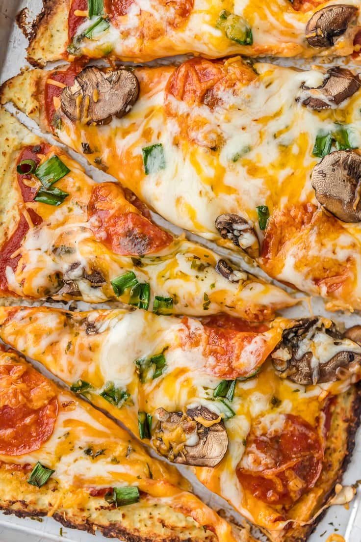 Pepperoni Mushroom Cauliflower Crust Pizza is LOW CARB and delicious! EASY and healthy recipe still full of flavor! We love cauliflower pizza crust!