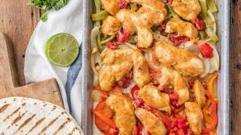 Sheet Pan Chicken Fajitas are one of our favorite healthy dinners! These baked chicken fajitas are lighter in calories and fat, but still packed with flavor. These healthy chicken fajitas are an easy sheet pan fajitas recipe that everyone will love. It's the perfect dinner for two!