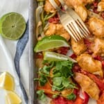 SKINNY BAKED SHEET PAN CHICKEN FAJITAS are our favorite healthy dinner! Such an easy recipe that everyone will love. Made with greek yogurt instead of sour cream! Perfection.