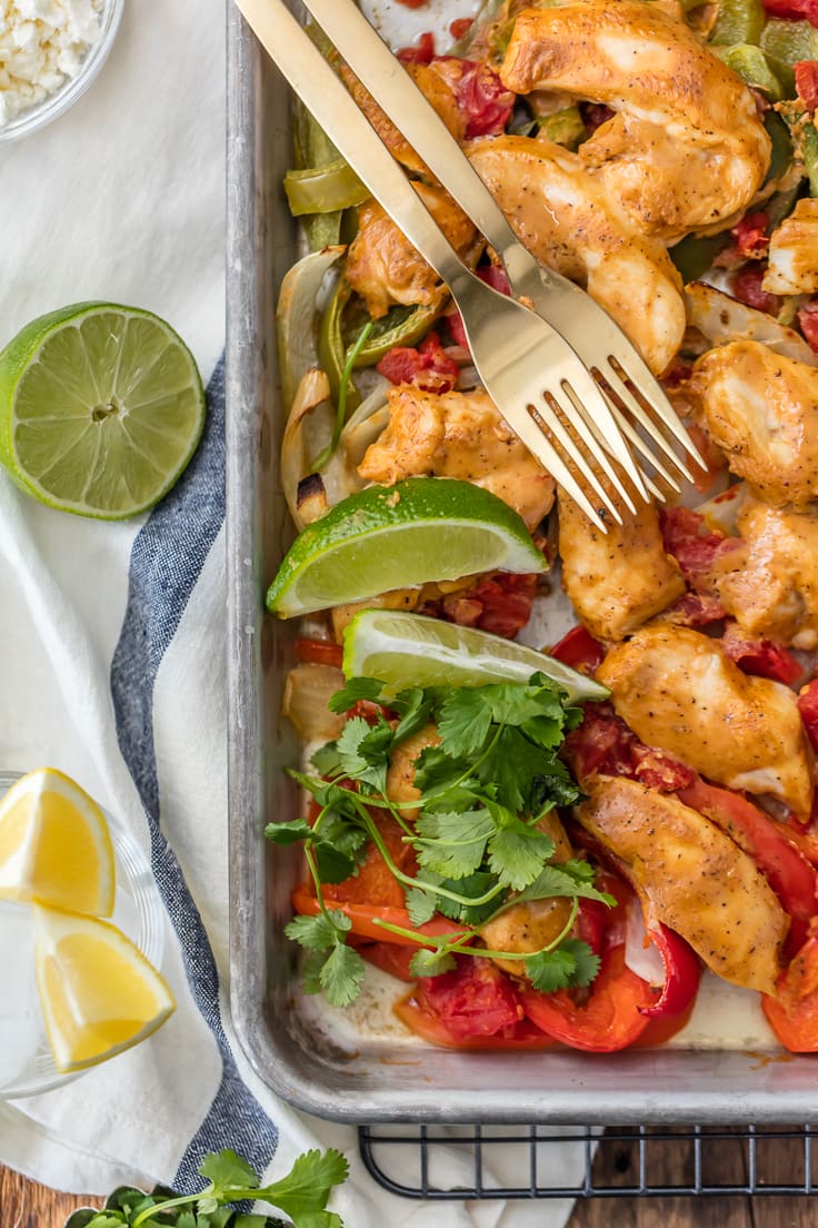 SKINNY BAKED SHEET PAN CHICKEN FAJITAS are our favorite healthy dinner! Such an easy recipe that everyone will love. Made with greek yogurt instead of sour cream! Perfection.