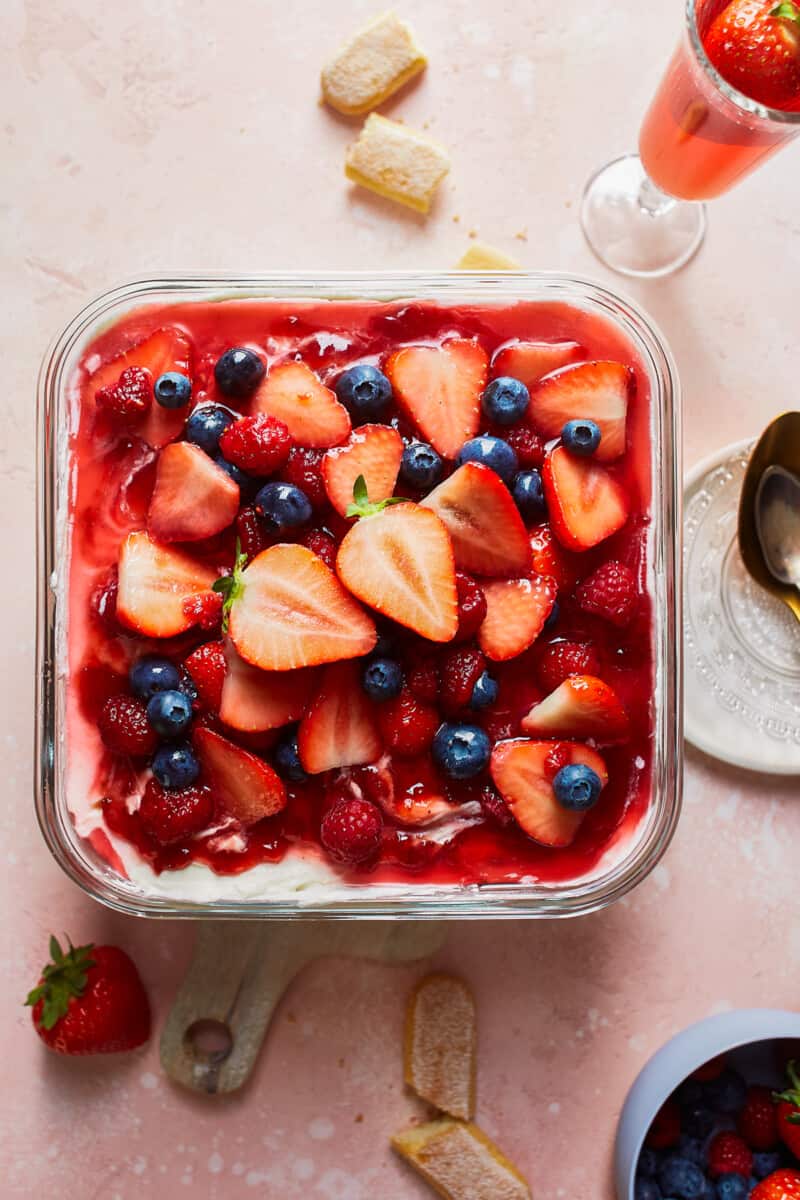 Strawberry Tiramisu with Blueberries and Raspberries is a delicious triple berry dessert! This fruity tiramisu recipe is sweet, beautiful, easy, and SO delicious. It's the perfect easy dessert recipe for Valentine's Day, 4th of July, or any other day of the year! triple berry tiramisu in pan
