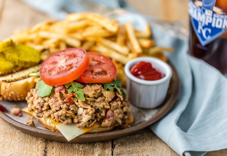 Slow Cooker Bacon Cheeseburger Sloppy Joes will wow the entire family! This easy crock pot sloppy Joes recipe is creamy, delicious, and loved by all. open faced Bacon Cheeseburger Sloppy Joes sandwich