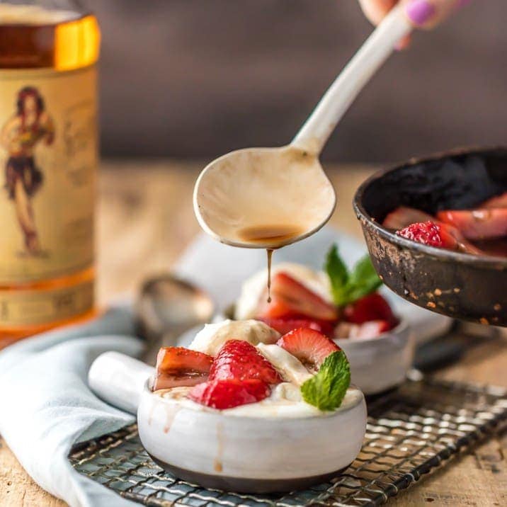 Forget Bananas Foster and make this SUPER EASY Strawberries Foster! Delicious, easy, and beautiful! Impress guests with Strawberries Flambe over ice cream! The best dessert for entertaining.